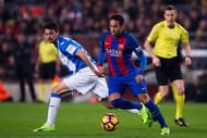 BARCELONA, SPAIN - FEBRUARY 19:  Neymar Santos Jr of FC Barcelona dribbles past Erik Moran of CD Leganes during the La Liga match between FC Barcelona and CD Leganes at Camp Nou stadium on February 19, 2017 in Barcelona, Spain.  (Photo by Alex Caparros/Getty Images)
